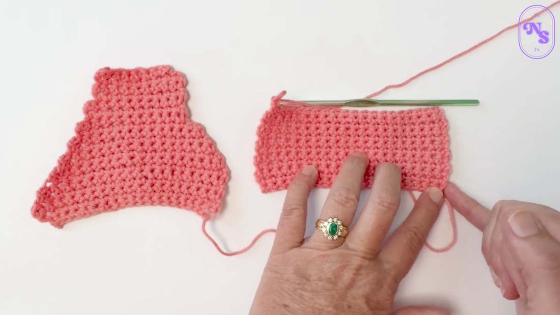 Lady showing a shrinking project - a common beginner crochet mistake